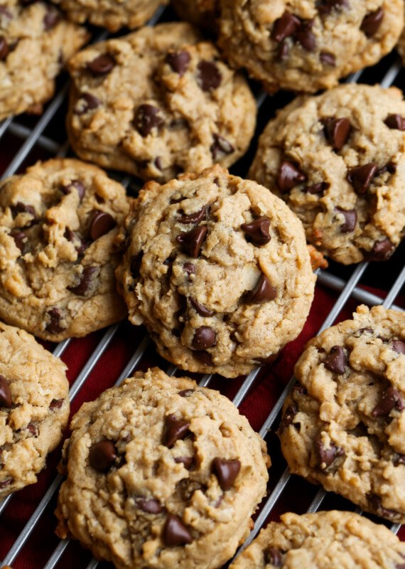 Peanut butter oatmeal cookies with chocolate chips on a cooling rack from above