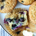 Half a muffin with the wrapper peeled off.