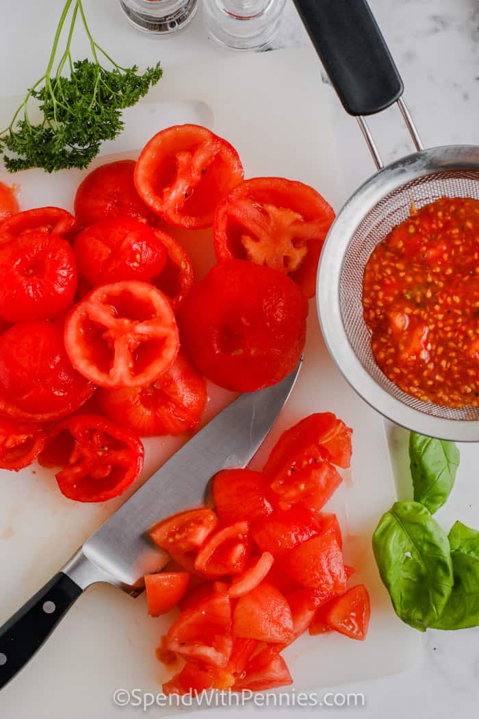 slicing tomatoes to make Fresh Tomato Sauce