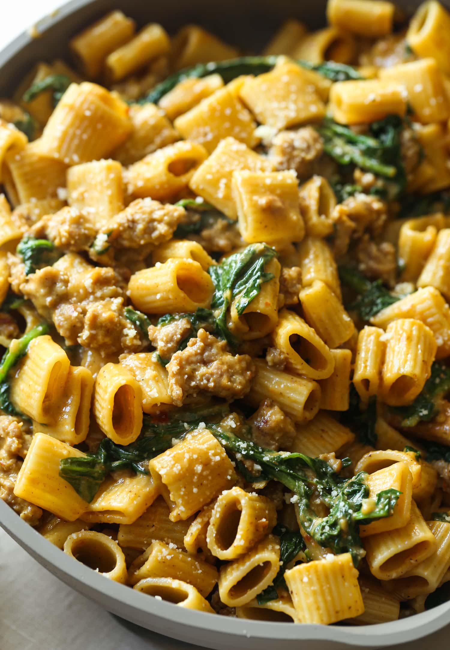 Rigatoni in a cream sauce with spinach and sausage.