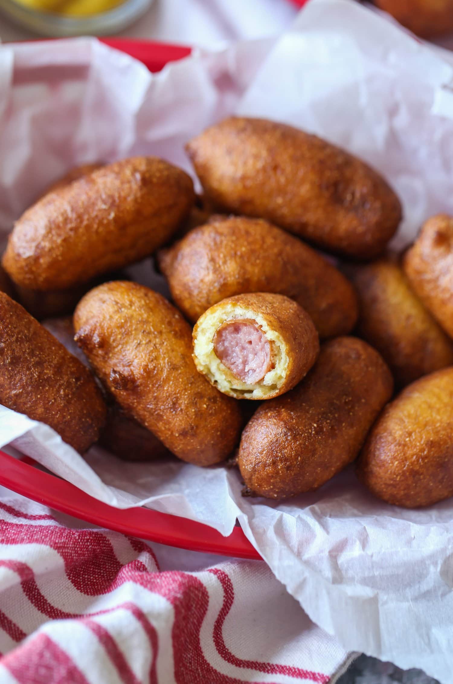 Fried corn dogs in a basket.